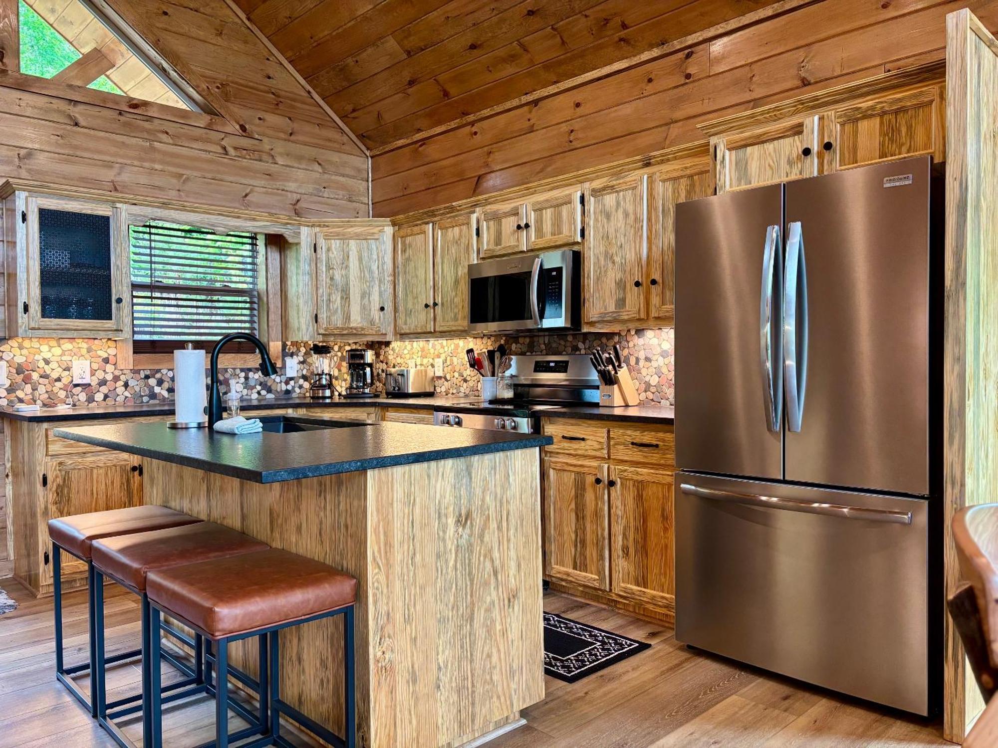Out Of The Ashes Is A Brand New 3 Bedroom With High End Touches, Hot Tub, And A Mountain View!
